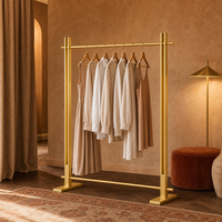 Porte-vêtements simple en acier inoxydable doré brossé, avec barre de base stabilisatrice et joints soudés sans couture, OEM ODM, pour boutiques de vêtements sur mesure
