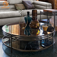 Table basse ronde à double niveau avec rangement, plateau en verre trempé noir et structure circulaire en acier inoxydable, style contemporain
