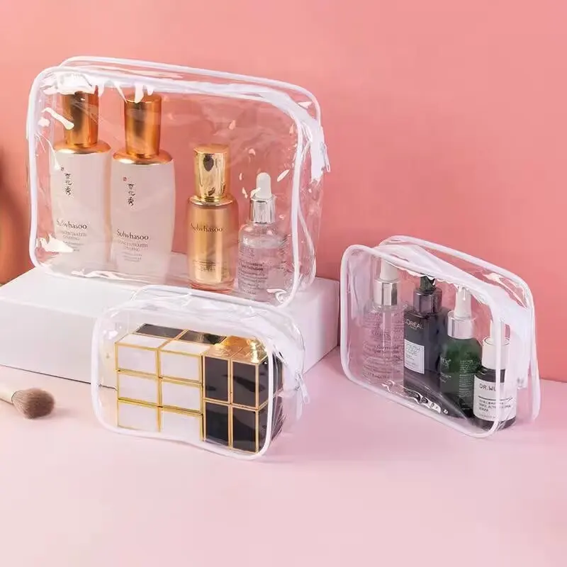 Venta caliente Organizador Logotipo personalizado Mujeres Bolsas de maquillaje transparentes Bolsas de aseo de viaje Bolsa de cosméticos de PVC transparente con cremallera