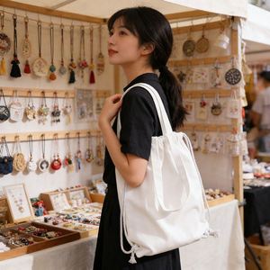 ถุงผ้าแคนวาสพิมพ์ลายแฟชั่นพร้อมเชือกผูก สำหรับใส่ของขวัญหรือใช้เป็นกระเป๋าช้อปปิ้ง  รับสกรีนโลโก้ตามแบบ - Product Image 2