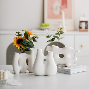 White Matte Bisque Irregular Shaped Nordic Ceramic Vase with Natural Texture for Wedding Home <b>Decor</b> Centerpiece Display - Product Image 1