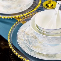 Service de table en porcelaine fine à bord doré, assiettes et bols élégants à motifs floraux gris en relief, collection de vaisselle de mariage de style royal