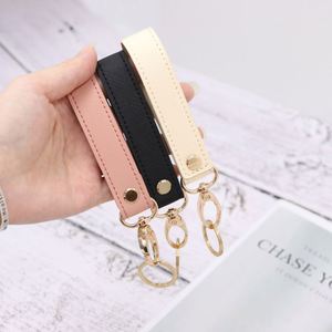 Stocked Premium PU Leather Wrist Strap Keychain Portable Car Key Holder Metal Keyring Promotional Business <b>Gifts</b> - Product Image 1