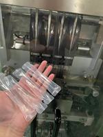 Servomoteur à quatre voies automatique Pompe à rotor Pâte alimentaire Sachet de sauce épaisse Machine de remplissage et de scellage de forme verticale