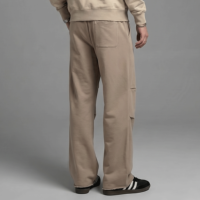 Pantalon de survêtement large pour homme avec cordon de serrage élastique à la taille, détail froncé aux genoux, bande latérale, coupe décontractée épaisse, personnalisable avec logo