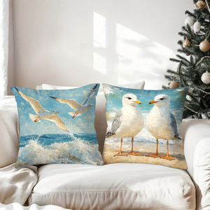 Des coussins décoratifs sur le thème des mouettes ornent un canapé confortable avec des chaussettes de Noël festives en arrière-plan. - Product Image 3