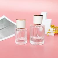 Nuevo Estilo Botella de Perfume de Vidrio de Lujo de 30ml con Forma de Cilindro y Frasco de Vidrio Transparente con Atomizador de 50ml
