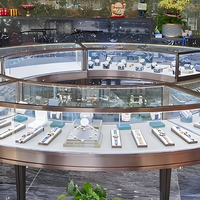 Hochwertiger Schmuckladen Metall-Inselvitrine Gebogene Glas-Vitrine Maßgefertigte Uhrenvitrine mit LED für Uhrengeschäfte