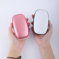 Banques d'alimentation chauffe-mains tendances avec lanière nouveaux produits centrales portables batterie mobile 10000mah pour l'hiver