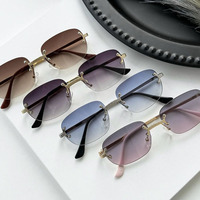 Vente en gros de nouveautés de bonne qualité Designer 2025 Lunettes pour femmes Lunettes de soleil rectangulaires à monture sans monture en diamant pour hommes Luxe