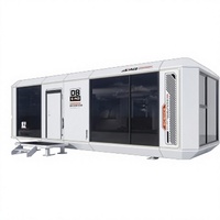 Maison conteneur modulaire avec mur en bois grainé, porte vitrée, verre isolant personnalisable, usage bureau, maison préfabriquée pour un transport facile
