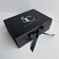 Boîte pliante rigide noire d'impression de logo de marque personnalisée à bas quantité minimale de commande Boîte de papier à rabat magnétique avec ruban pour vêtements et cadeaux