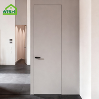 Porte invisible sans cadre en alliage d'aluminium de style moderne avec panneau en bois encastré de la même couleur que le mur pour portes intérieures