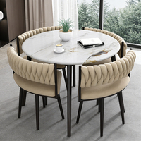 Ensemble de table et de chaises de salle à manger moderne avec cadre en fer et plateau en marbre pour petit appartement