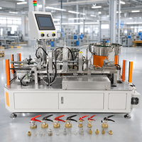 Machine à visser les valves pour la production d'extincteurs avec fixation pneumatique et fonction de chargement automatique