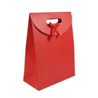 Sac cadeau en papier noir haut de gamme personnalisé avec logo doré à chaud, pelliculage mat, estampage, découpe, poignée et nœud en ruban
