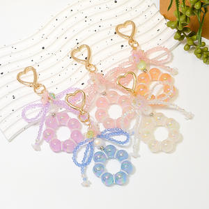 จี้กระเป๋าคริสตัลหลากสีประดับลูกปัดโลหะผสมสังกะสีรูปโบว์ดอกไม้สุดน่ารักสำหรับพวงกุญแจ - Product Image 1