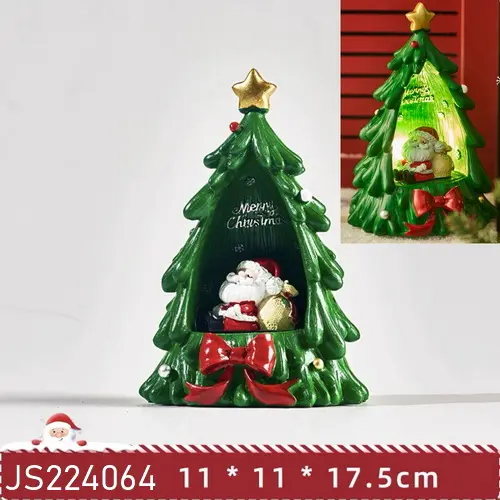 La batteria a LED di natale illumina l'albero di natale in poli resina con la decorazione natalizia della scena dell'officina