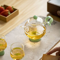 Théière en verre transparente résistante à la chaleur, bouilloire à eau, théière à fleurs avec poignée verte et infuseur, vaisselle de restaurant