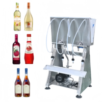 Machine de remplissage de petites bouteilles de liquide par gravité à 4 têtes Machine de remplissage de liquide à pompe pour vin, whisky, eau, jus et liqueur