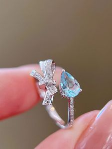 Bague Xinfly en or 18 carats avec nœud en ruban, diamant naturel et aigue-marine, design tendance papillon et goutte d'eau pour mariages, cadeaux et fêtes - Product Image 2