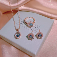 Nouveau collier de luxe léger, ensemble de trois pièces de niche, orné de zircons ovales bleu clair en forme d'œuf, en acier titane, best-seller
