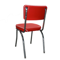 Chaise rembourrée rouge vintage avec passepoil blanc, pieds en métal chromé, mobilier de style rétro pour restaurant