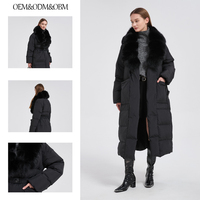 Veste d'hiver longue et brillante noire surdimensionnée coupe-vent pour femmes avec col en fourrure de renard véritable et doublure en duvet d'oie
