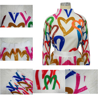 Offre Spéciale deux pièces ensemble femmes vêtements Unique Art imprimé plissé à manches longues t-shirt et grande jupe balançoire 2 pièces jupe ensembles