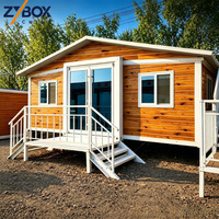 Maison conteneur modulaire extensible de 20 pieds à pente unique, finition bois de pin, porche en acier blanc, cabane rurale préfabriquée en rangée