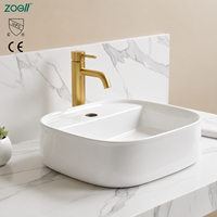 Vasque en céramique blanche en gros de l'usine de Chaozhou, design ovale moderne pour salle de bain, lavabo mural artistique pour se laver les mains, toilettes