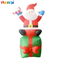Ballon publicitaire de Noël gonflable personnalisé 6 pieds 8 pieds Vente du Père Noël Boîte-cadeau de Noël assis sur place