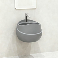 Ensemble de salle de bain en céramique de luxe noir et or en forme d'œuf, lavabo mural et toilettes GoodSell, lavabo sur pied