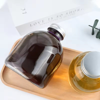 Envase de vidrio esmerilado de 300ml y 500ml con forma de bulbo, tapa de rosca de acero estañado, reciclable, para uso doméstico, para zumos, bebidas fermentadas y licores de frutas.