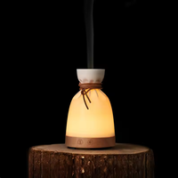 Diffuseur d'arômes créatif en forme de pochette avec base en bois, humidificateur ultrasonique d'huiles essentielles, attache en cuir pour chambre, spa, boutique, cadeau