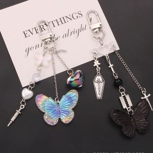 New Sweet Cool Style Cross Needle Pendant Metal <b>Keychain</b> <b>Personalized</b> Creative Bow Tie Hanging Chain Earphone Set Decoration - Product Image 3