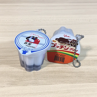 Vente en gros usine Mini porte-clés alimentaire 3D, porte-gobelets en plastique mignons en forme de pudding, jouet de décompression léger en gelée souple imprimé UV