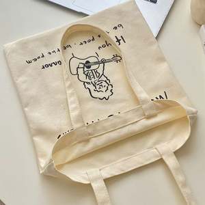 กระเป๋าผ้าแคนวาสพิมพ์โลโก้ตามสั่ง พร้อมหูหิ้วเชือก  รักษ์โลก ใช้ซ้ำได้ พับเก็บได้ มีซิปปิด - Product Image 1