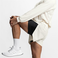 Vente en gros Short de cyclisme de jogging à séchage rapide 2 en 1 vierge Short d'entraînement de gymnastique en nylon et polyester avec poche pour téléphone