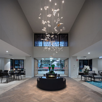 Lustre en verre ANNO avec design nuage organique, luminaire suspendu moderne pour salle à manger de villa de luxe