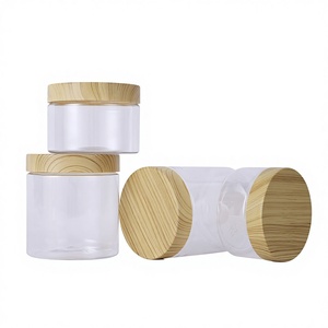 Vente en gros de pots cosmétiques en PET ambré/transparent avec couvercle en <span class=keywords><strong>bambou</strong></span>, pots pour beurre corporel avec logo personnalisé, 50 ml-500 ml - Product Image 1