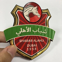 Vente en gros Étiquette de transfert de chaleur métallique 3D Tpu brillante personnalisée Vêtements de sport de football Maillot Tpu Patch de football Badge Tpu