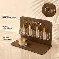 Support de présentation cosmétique moderne pliable en acrylique marron personnalisé avec 4 emplacements pour flacons de sérum et comptoirs de vente au détail de produits de beauté
