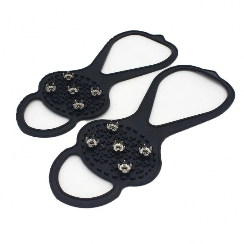 A pair of skates, crampons, and skate covers