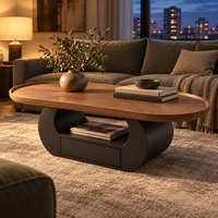Table basse ovale avec tiroir, plateau en bois massif, bord arrondi et base en arche noire pour un projet d'aménagement intérieur moderne