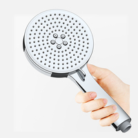Pomme de douche à effet pluie à main en plastique ABS Support en laiton Surface plaquée Robinet de salle de bain au design moderne à économie d'eau à 3 fonctions