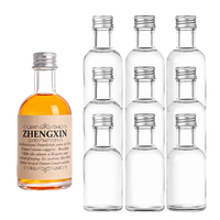 Bouteille de liqueur ronde mini de 100 ml en verre transparent avec étiquetage personnalisé pour les marques de vodka, gin et jus de gingembre