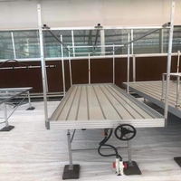 Table de culture hydroponique multi-niveaux à système d'irrigation par flux et reflux, bancs roulants réglables pour un accès facile