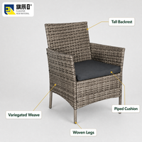 Fauteuil d'extérieur en osier gris à tons mélangés avec coussin anthracite