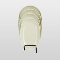 Assiette ovale en mélamine beige mat texturée sur mesure OEM, résistante à l'usure, facile à rincer, pour plat principal de restaurant occidental